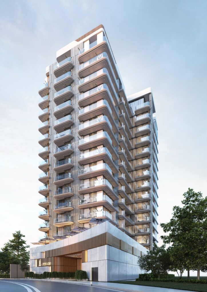 Iraz Developers Dubai Creek Project – Exterior View of Luxury Towers at Waterfront" Modern luxury towers at Dubai Creek waterfront, developed by Iraz Developers, featuring glass facades, skyline views, and urban landscaping under clear skies.